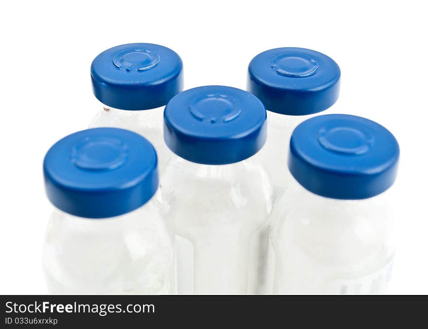 Vials of medicine on a white background