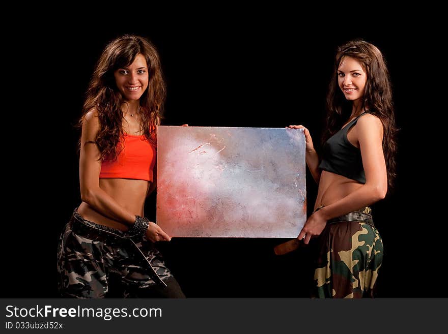 Image of a two girls holding a table