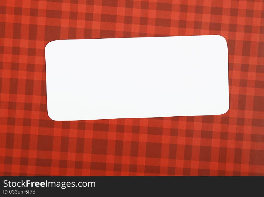 Greeting Christmas card with a red background white sheet of paper on which you can write a text