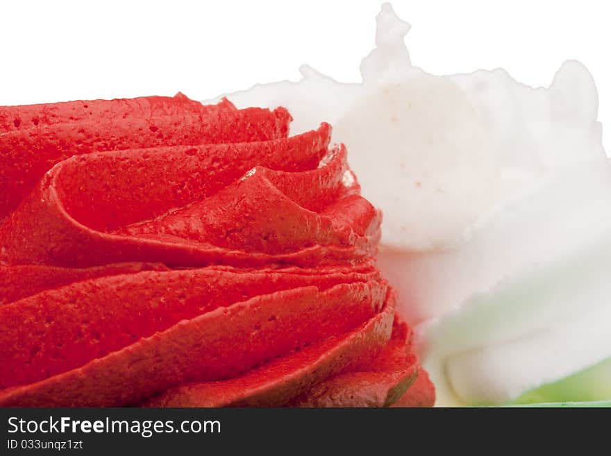 Cream of red and white colors as decoration on the cake. Cream of red and white colors as decoration on the cake.