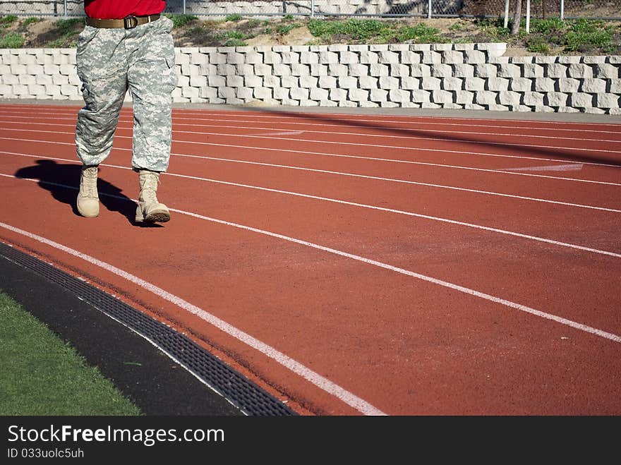 Training soldier in the army ammunition on the treadmill stadium.