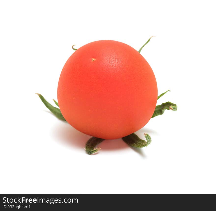 Red tomato close up it is isolated on a white background. Red tomato close up it is isolated on a white background.