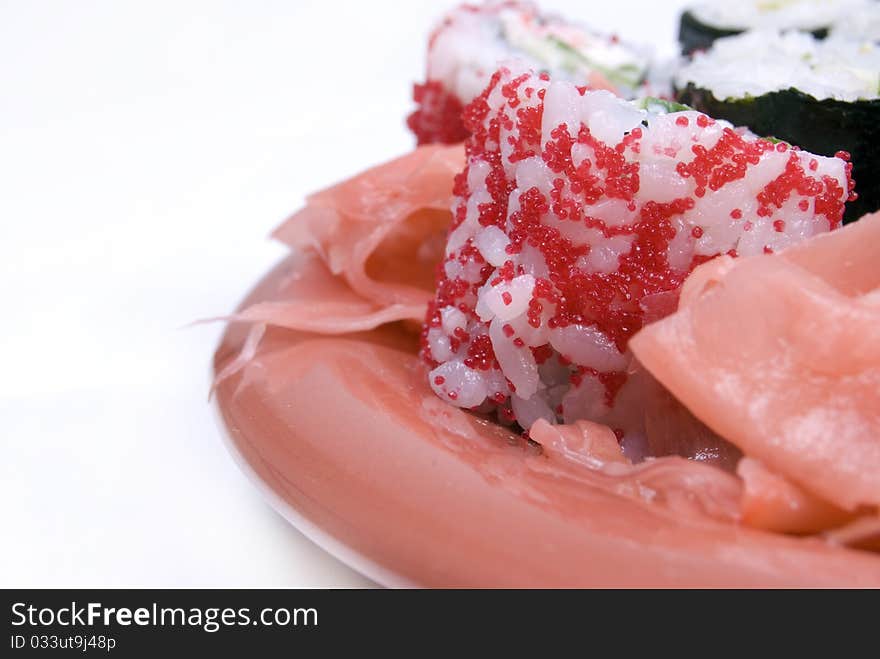 Close-up photo of appetizing Japanese rolls isolated on white. Close-up photo of appetizing Japanese rolls isolated on white