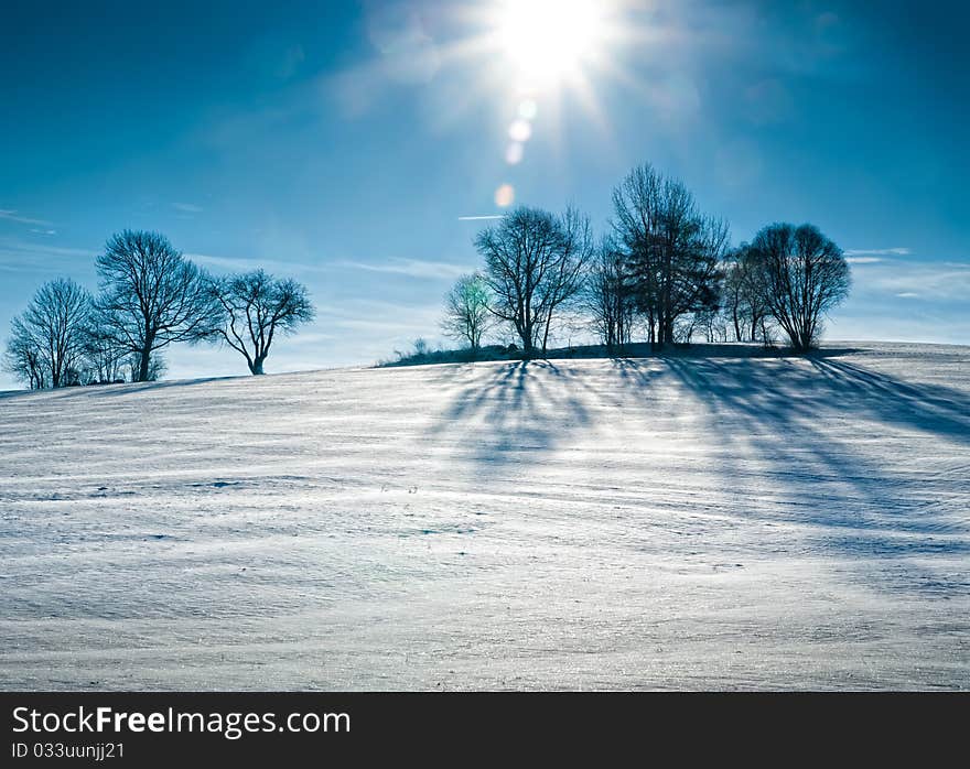 Sun over snowy Hill