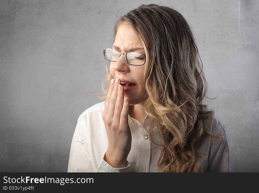 Beautiful woman with bored expression yawning