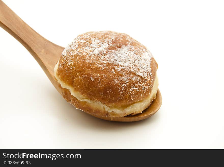 Donut with onto wooden spoons