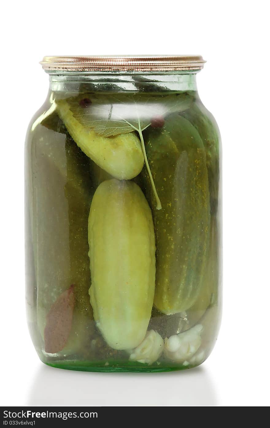 Glass jar with pickled cucumbers isolated on white background