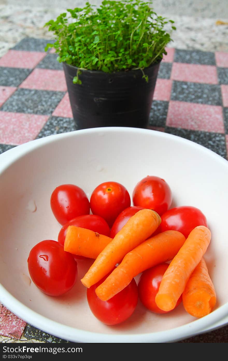 Baby carrot and fresh tomato