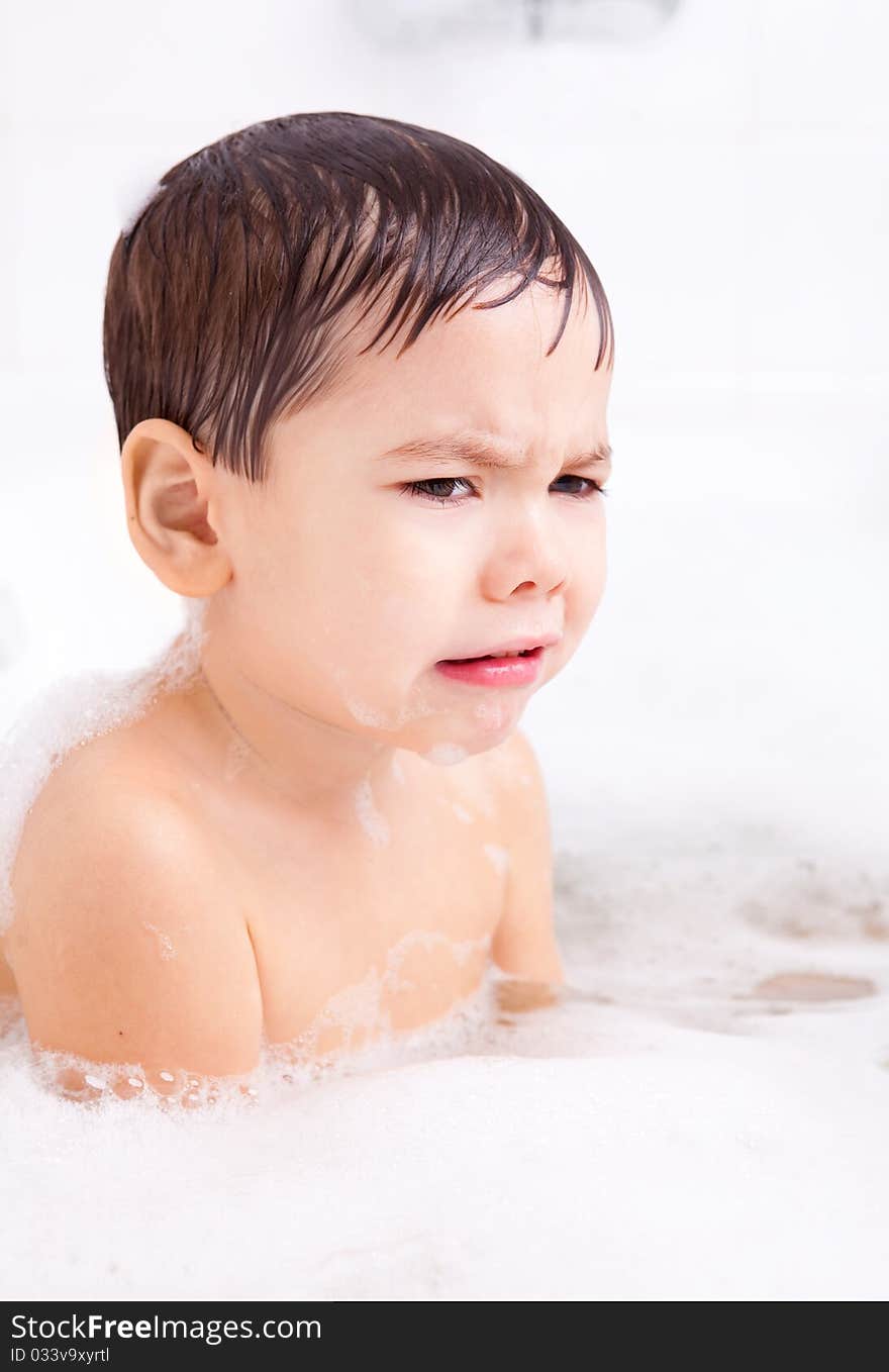 Displeased Boy Taking A Bath