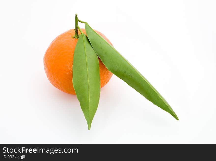 Mandarin orange with leaves isolated on a white background.