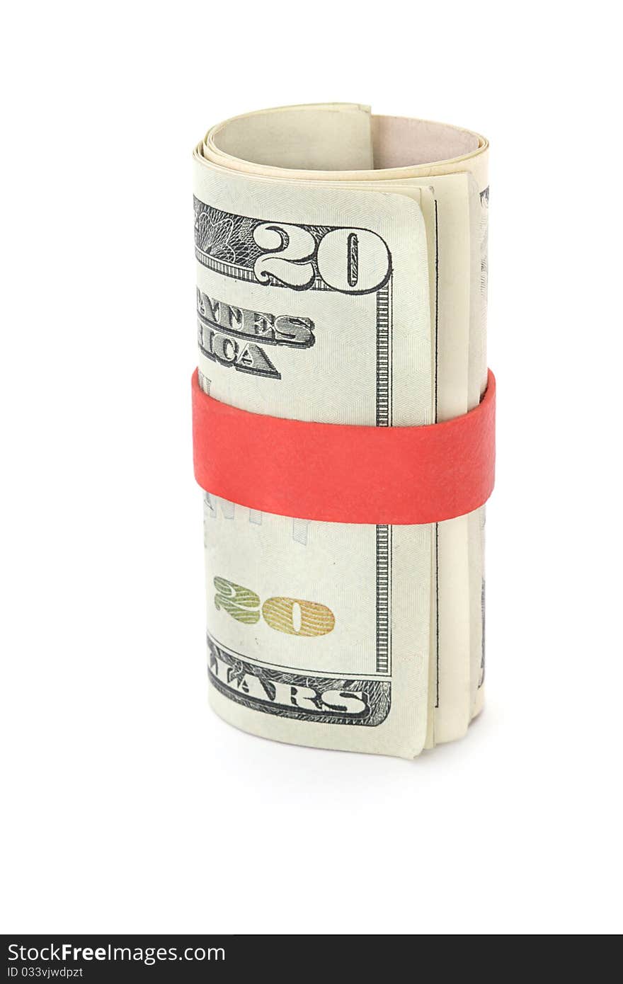 Twenty dollar bills held together with red elastic band signifying saving for the future. Twenty dollar bills held together with red elastic band signifying saving for the future