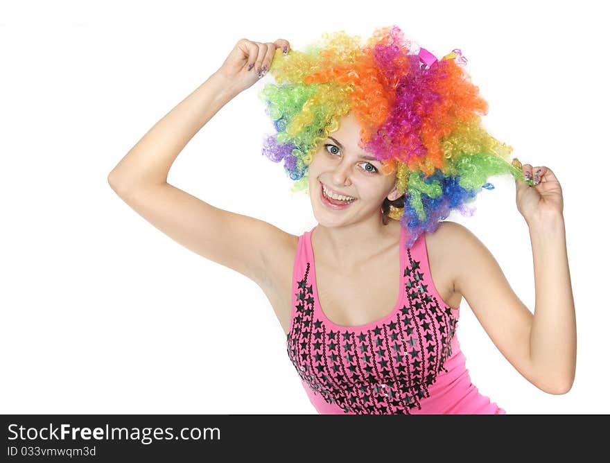 Happy woman in clownish wig over white