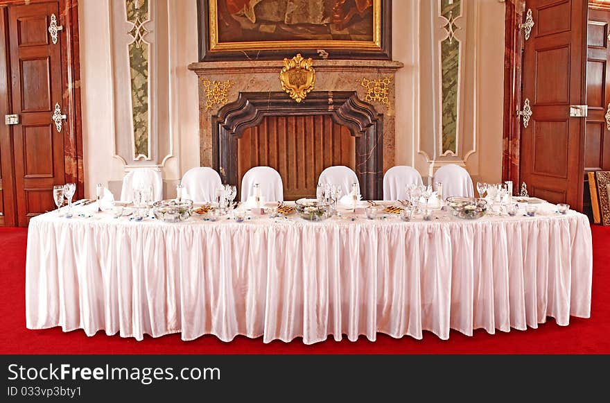 A photo of beautiful and in a luxury way set table ready for a very special occasion. A photo of beautiful and in a luxury way set table ready for a very special occasion.