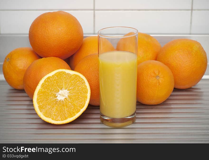 Oranges with a glass of orange juice. Oranges with a glass of orange juice