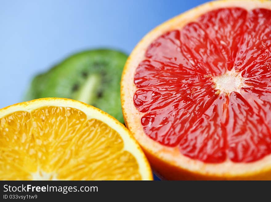Grapefruit and oranges on a blue background