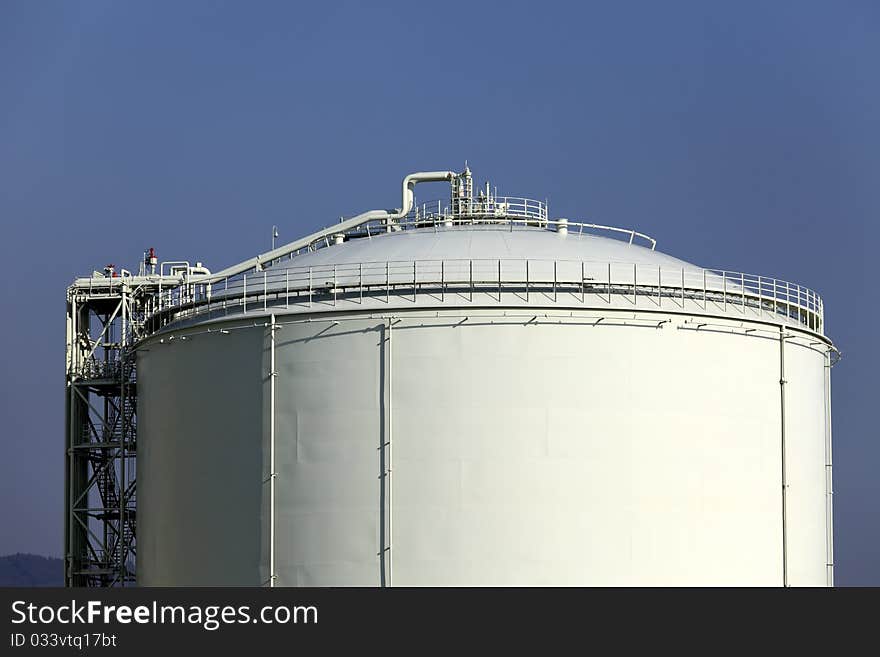 Storage tank and blue sky