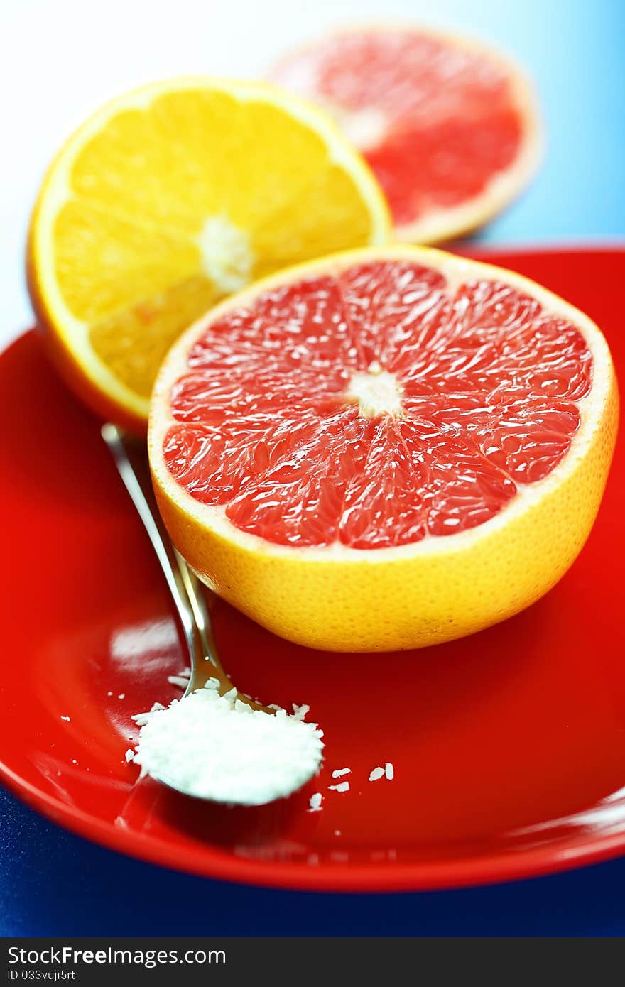 Grapefruit and oranges on a blue background