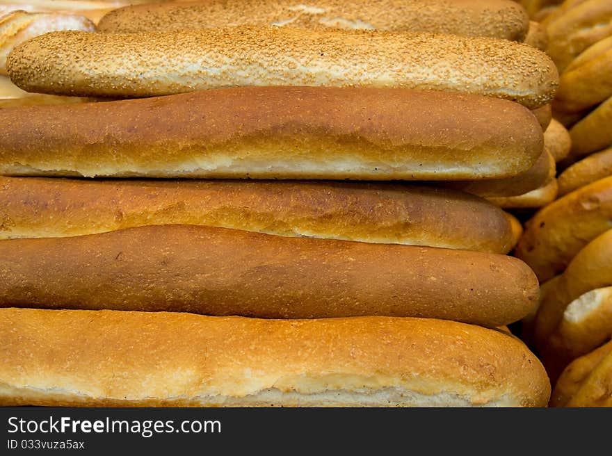 Lot of freshly baked french bread with crispy crust. Lot of freshly baked french bread with crispy crust