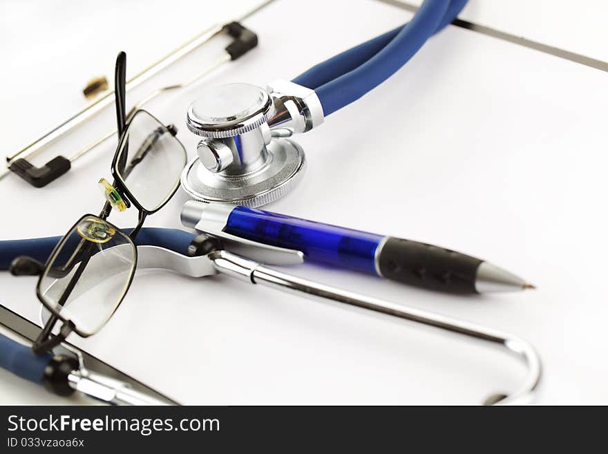 Blue stethoscope on a white background