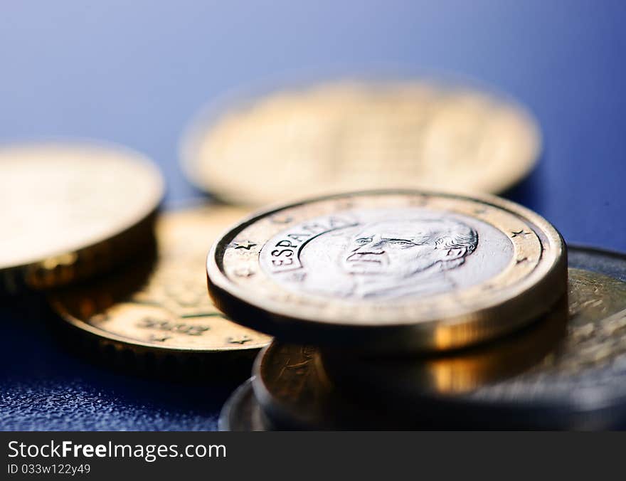 Euro coins closeup on blue background