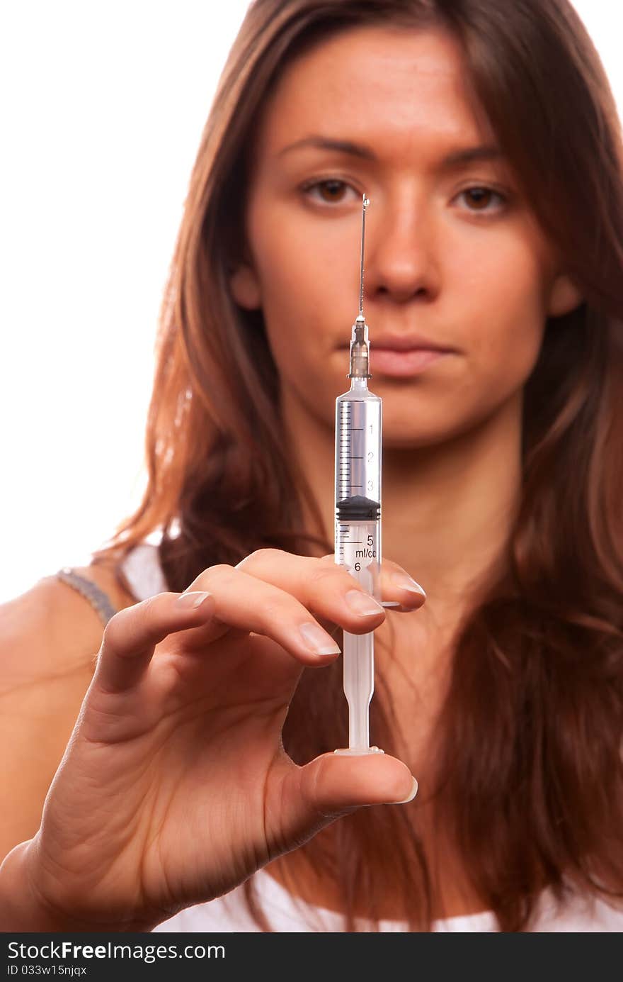 Young nurse female make holding medium medical syringe with needle getting ready for patient injection isolated on a white background. Young nurse female make holding medium medical syringe with needle getting ready for patient injection isolated on a white background