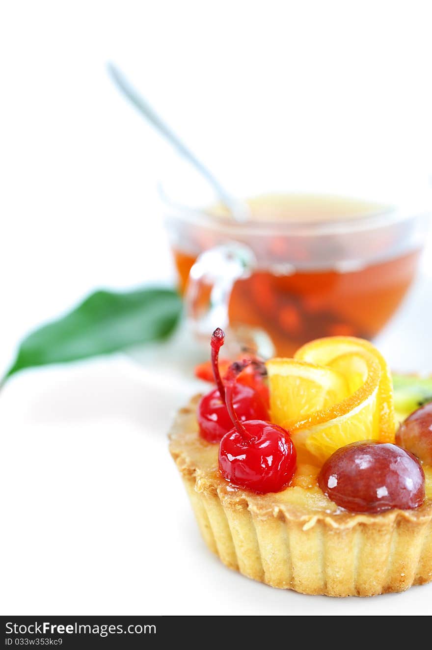 Cupcake with jelly and fruits over white