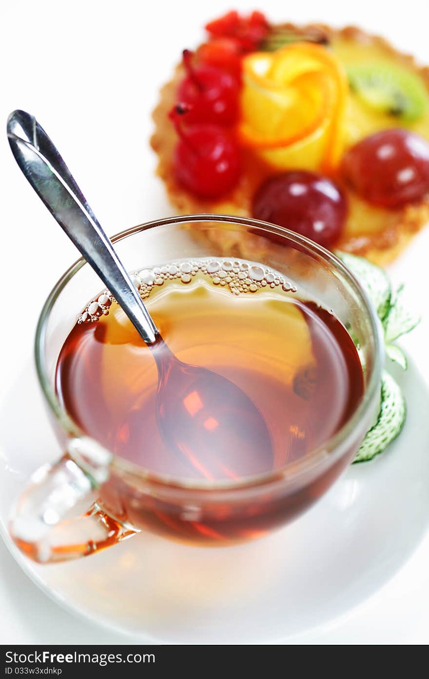 Tea in a transparent cup with leaf