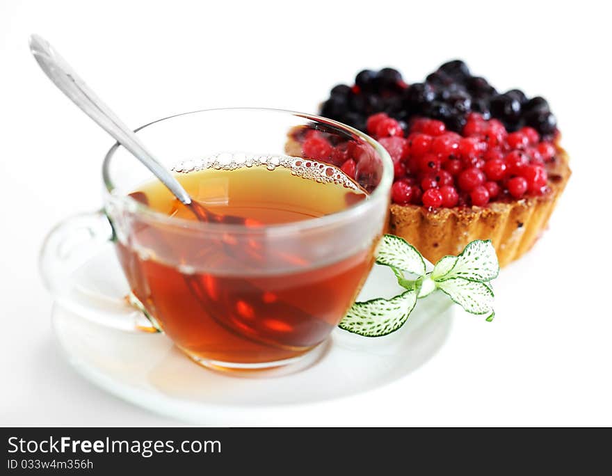 Tea in a transparent cup with leaf