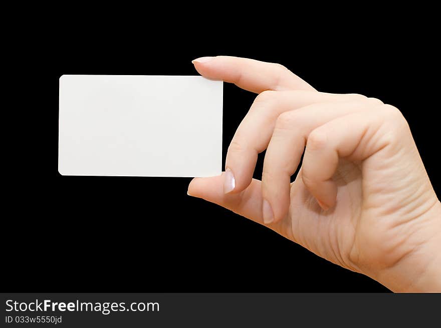 Paper card in woman hand on black background