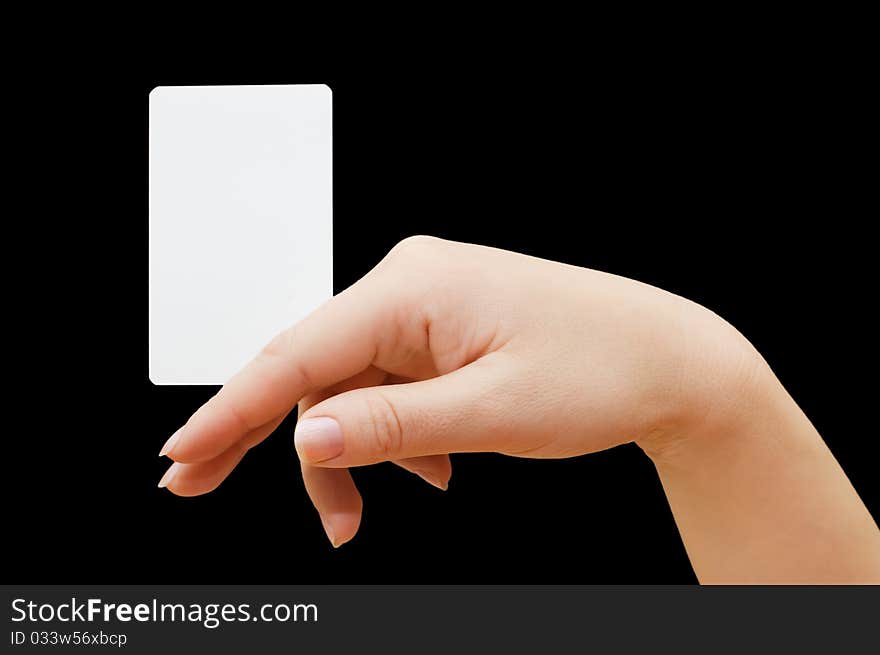 Paper card in woman hand on black background