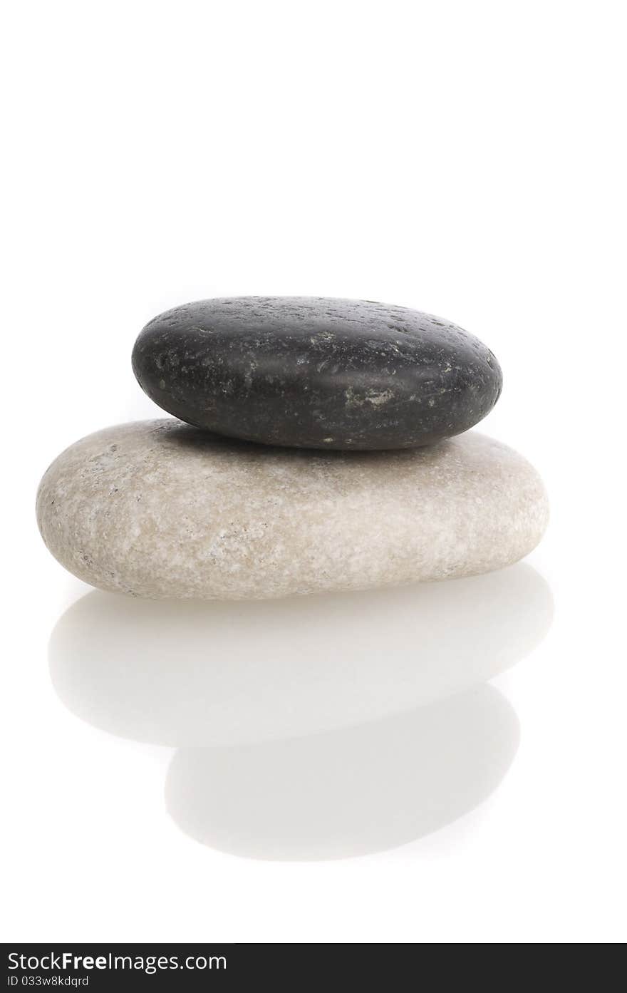 Black and white sea pebbles on white background isolated