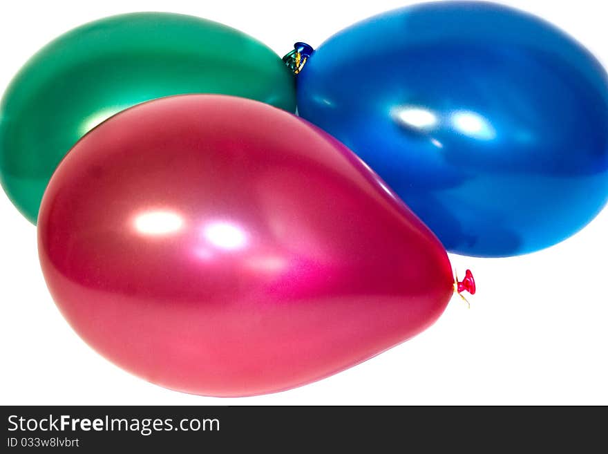 Red green dark blue balloons isolated on white