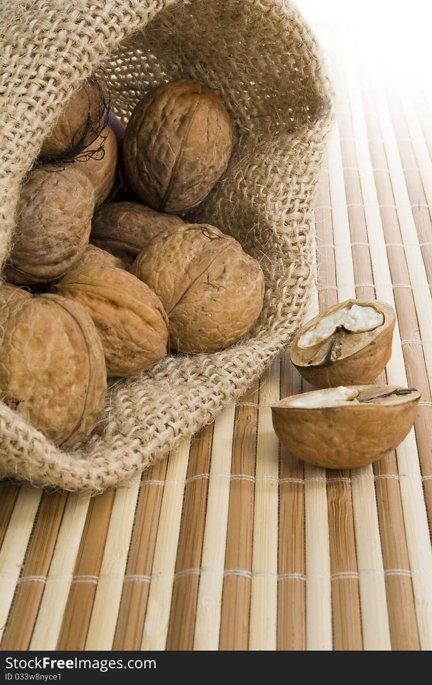 Close-up of walnut on bamboo background in sack