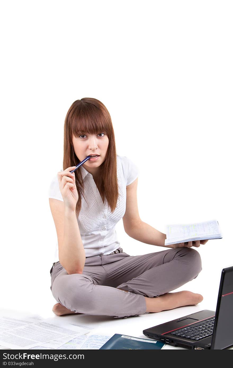 The young girl with the laptop and writing-books. The young girl with the laptop and writing-books