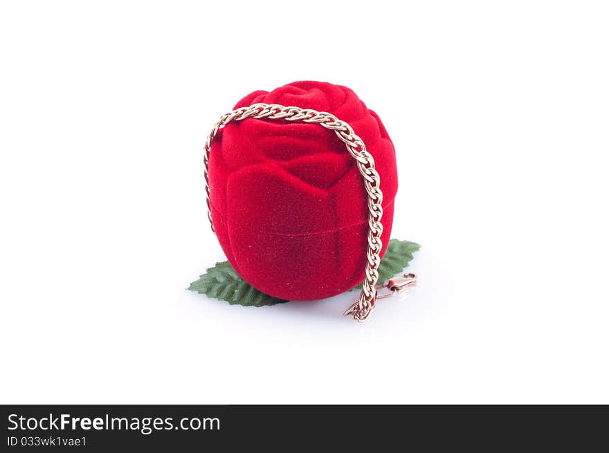 Gold bracelet and red gift packing , isolated white background.