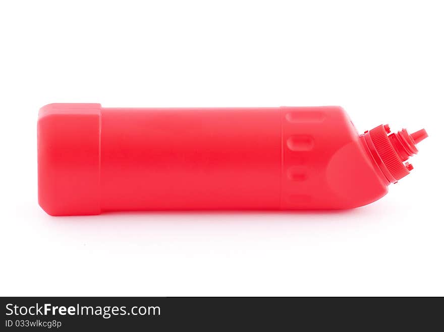 Red plastic bottle isolated on white background