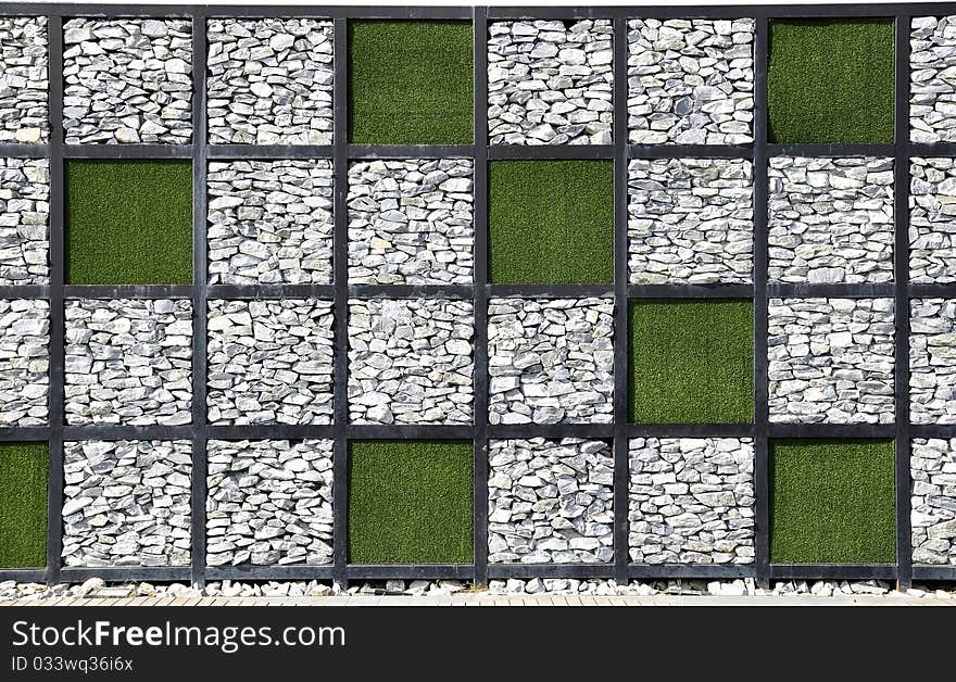 Modern stone wall. Combination of grass to a different format. Modern stone wall. Combination of grass to a different format.