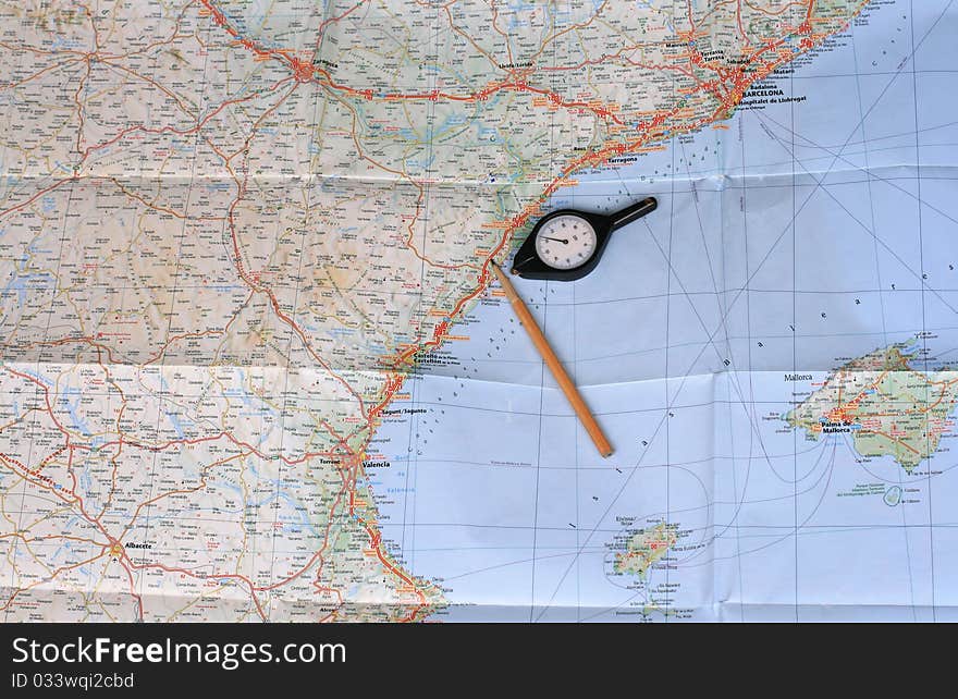 Map, pencil and curvimeter (map measurer)