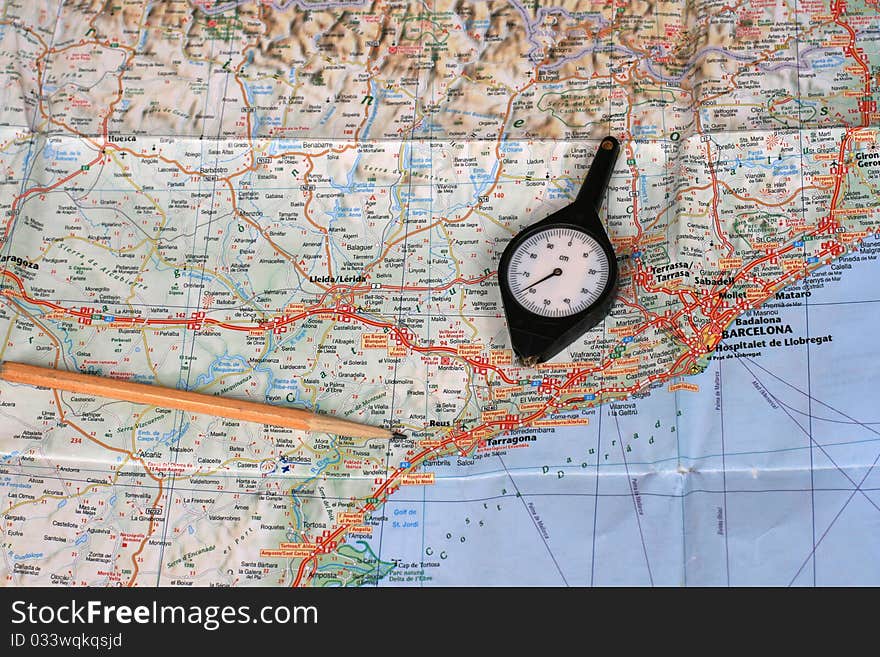 Map, pencil and curvimeter (map measurer)