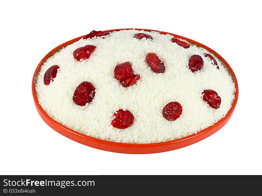 Coconut cake with dried cranberries isolated on white