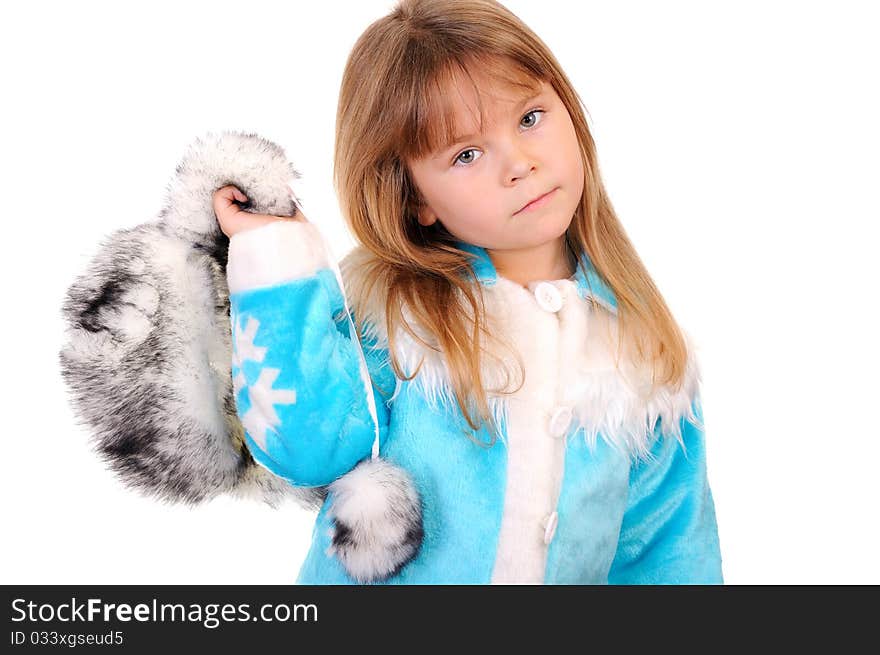 The girl holds in a hand a winter fur cap on a white background