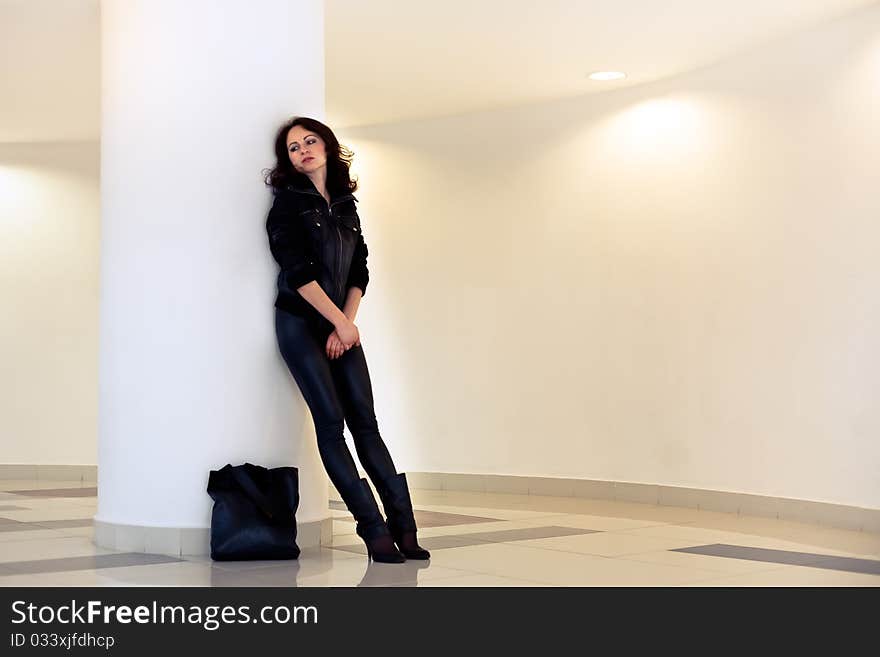 Woman with a bag of upset at the store arms crossed