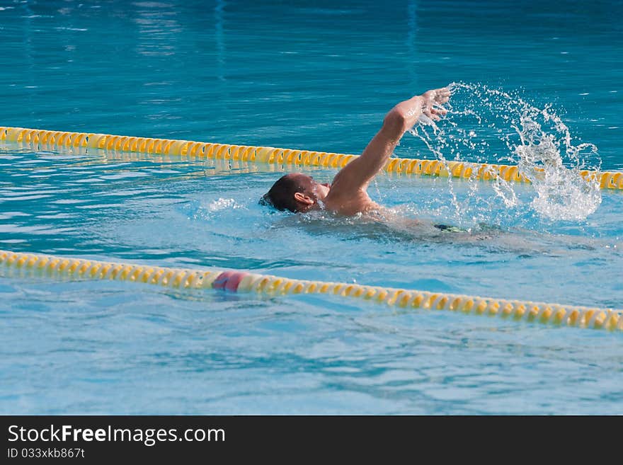 Man swimming in pool. Swim training