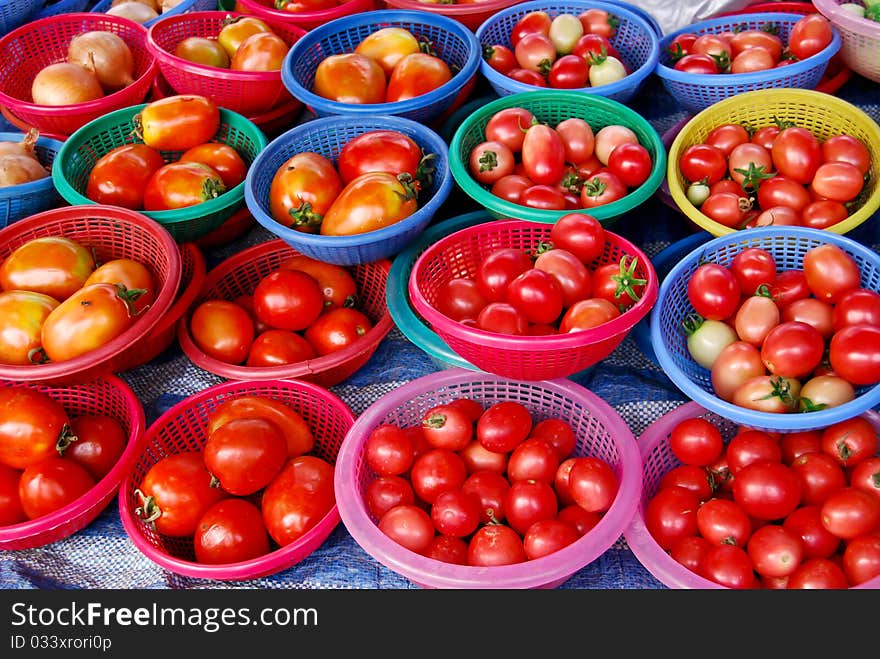 Many of fresh tomato in basket in fresh market , Asia , Thailand. Many of fresh tomato in basket in fresh market , Asia , Thailand