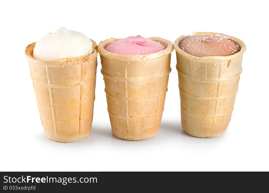 Three different flavors of ice cream cones... chocolate, vanilla, and strawberry. Three different flavors of ice cream cones... chocolate, vanilla, and strawberry