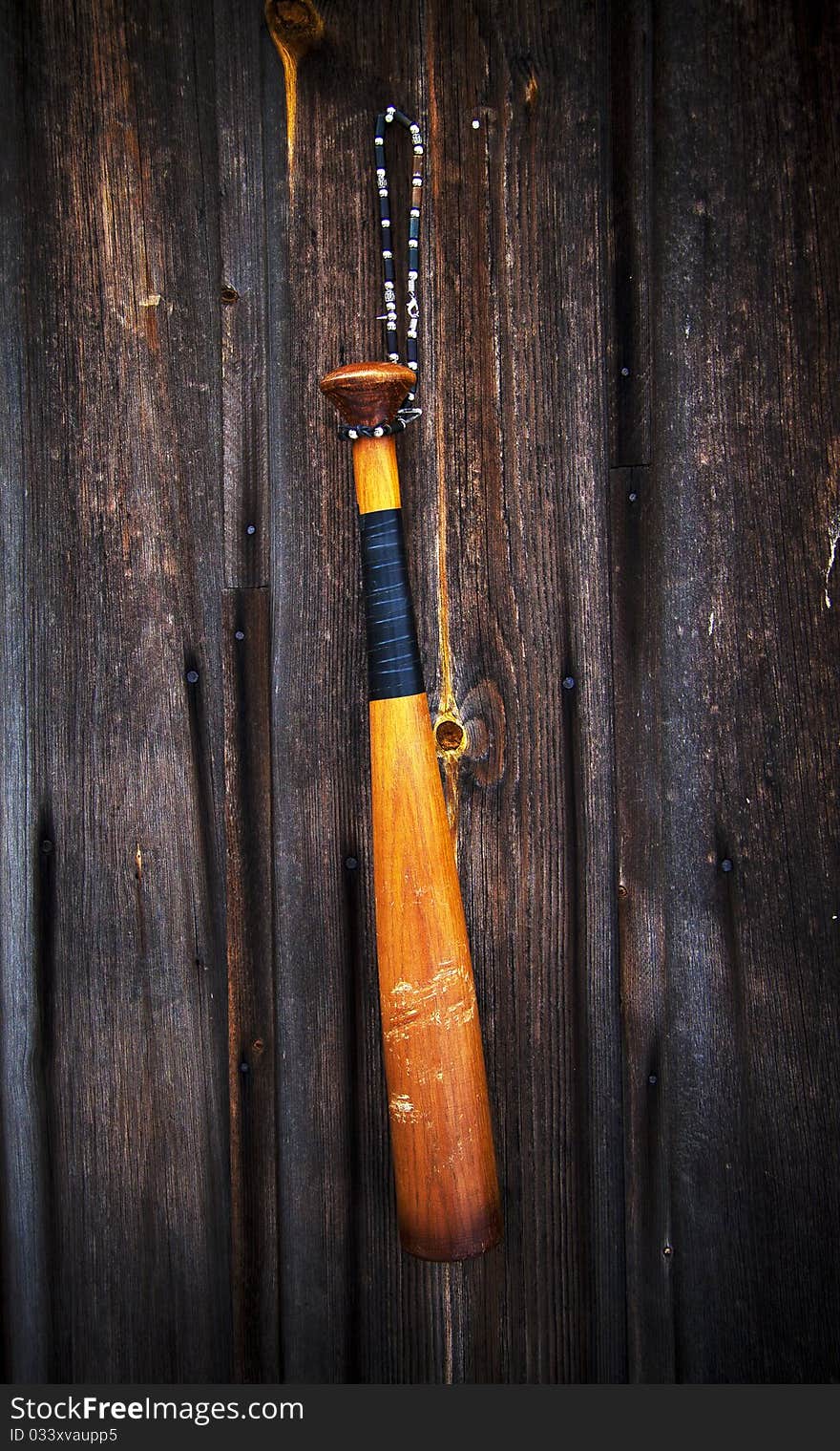 Baseball bat on a wooden background. Baseball bat on a wooden background