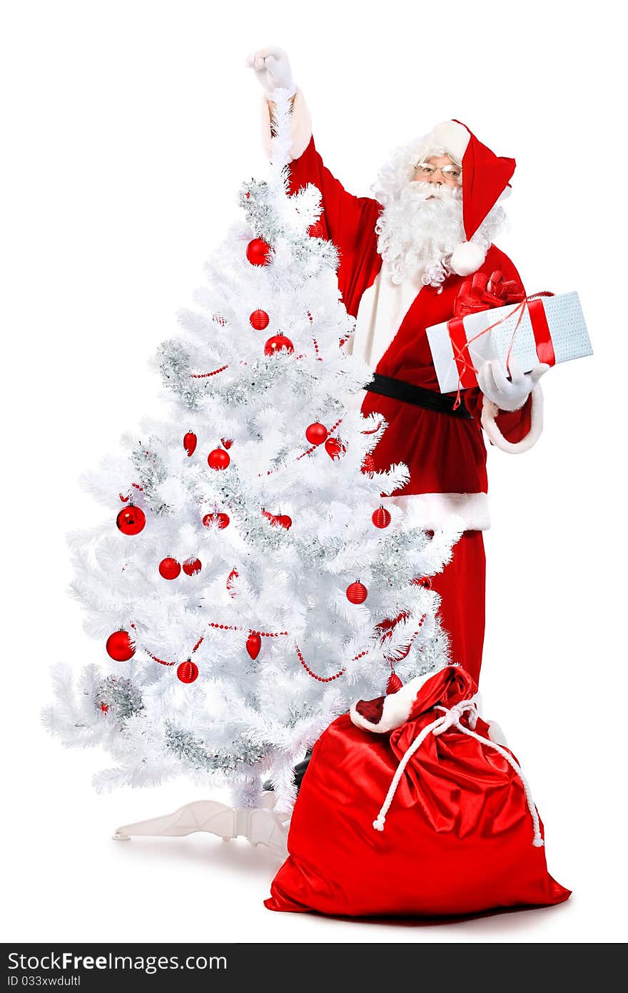 Christmas theme: Santa Claus with presents and christmas tree. Isolated over white background. Christmas theme: Santa Claus with presents and christmas tree. Isolated over white background.