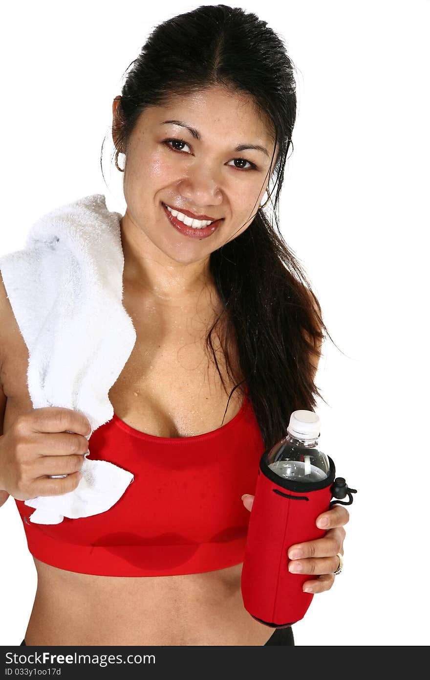 Beautiful 30 year old Filipino woman in workout clothes, towel and water bottle sweating over white background. Beautiful 30 year old Filipino woman in workout clothes, towel and water bottle sweating over white background.