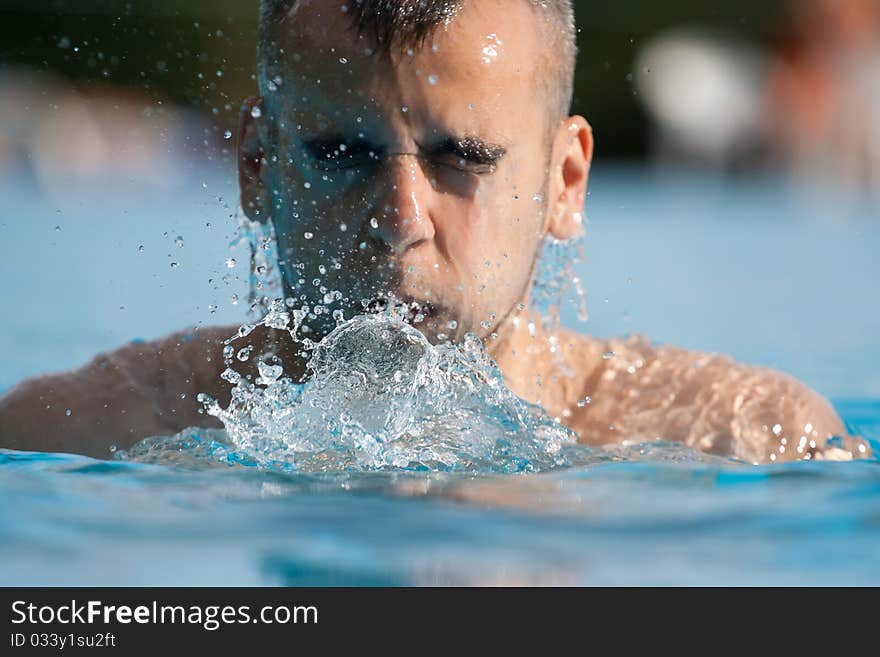 Man swimming in pool. Swim training