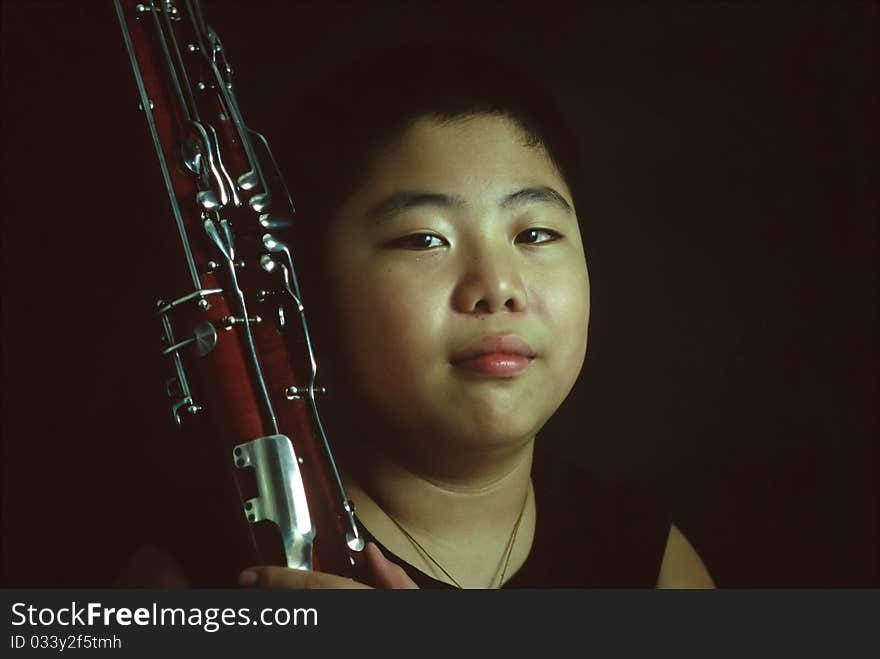 Portrait of a bassoon boy in practice